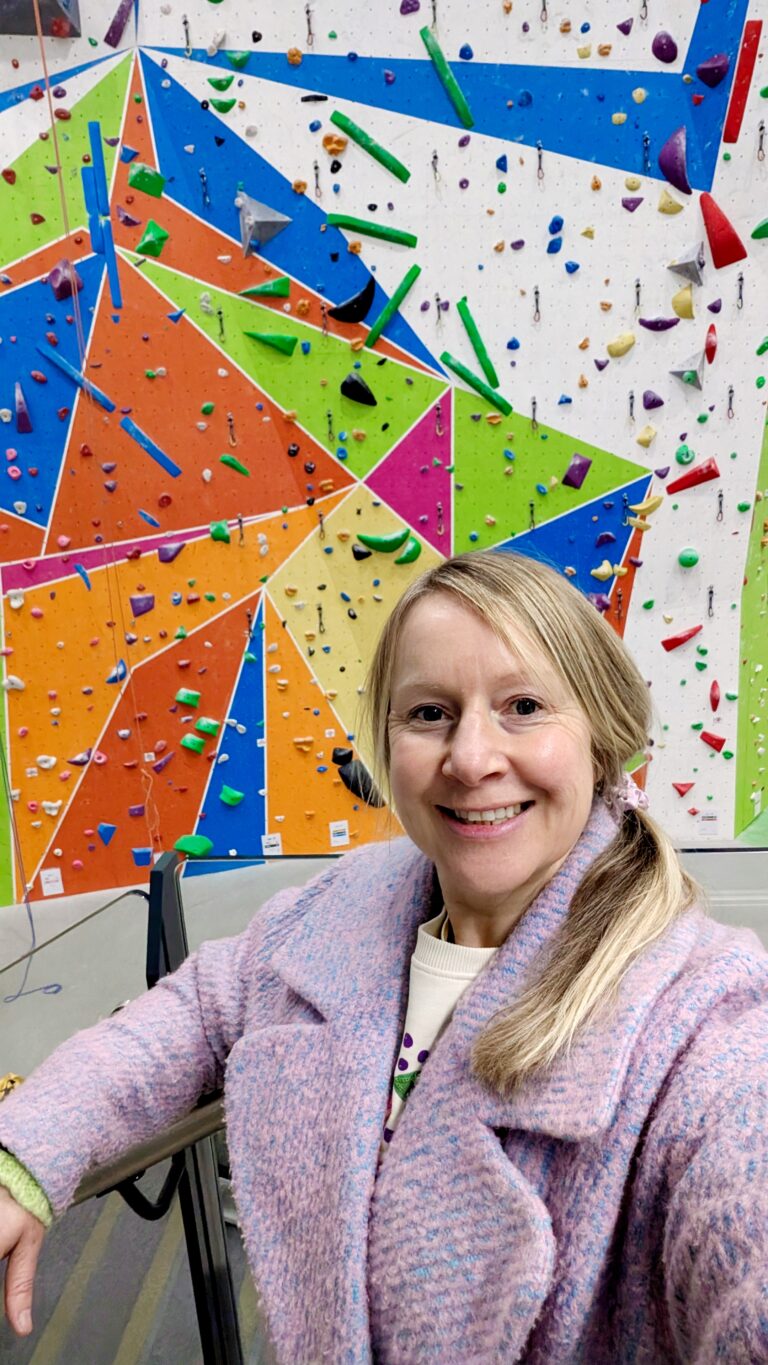 woman at a climbing wall